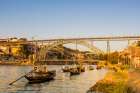 Rabelo boats near the Luis I Bridge over the Douro River, Porto, Portugal. Art Print